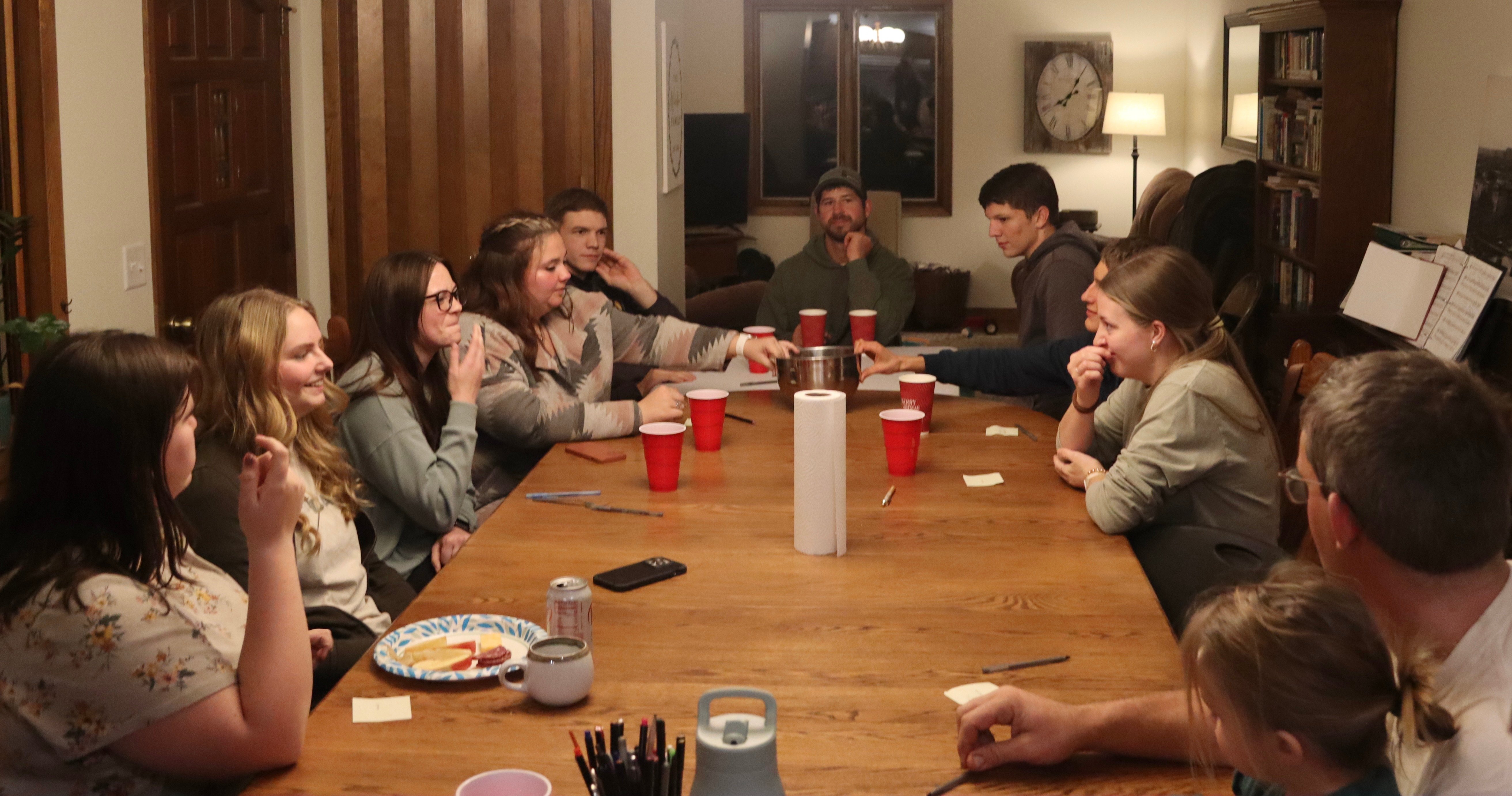 Students playing a game at a table